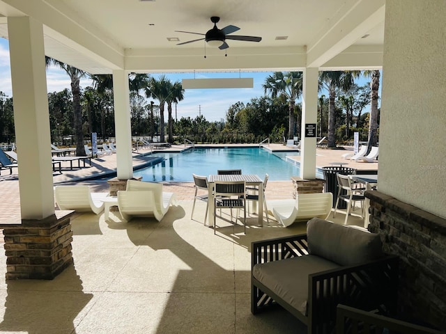 view of pool featuring a patio area and ceiling fan