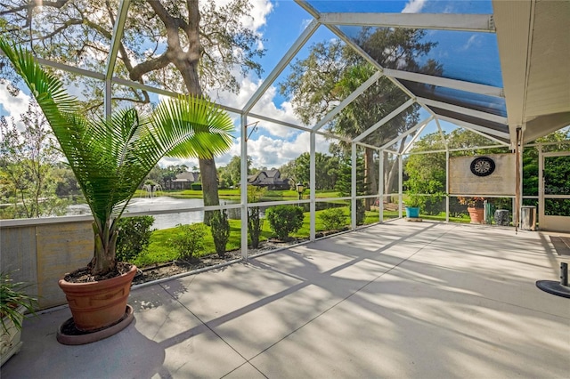 unfurnished sunroom with a water view