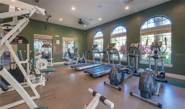 exercise room featuring a healthy amount of sunlight and ceiling fan