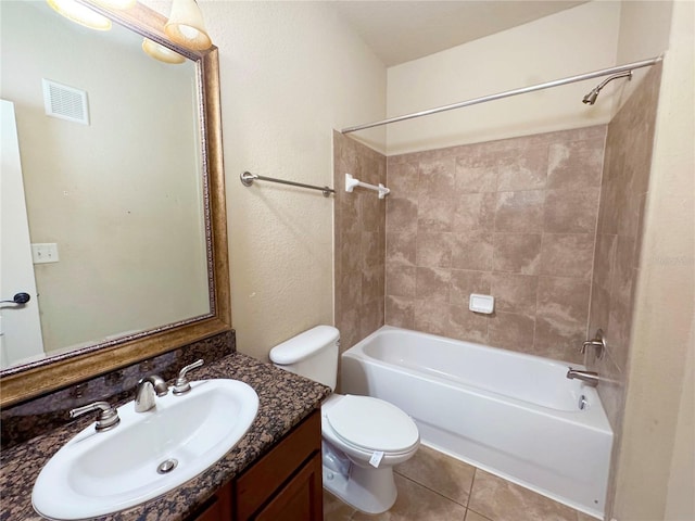 full bathroom with vanity, toilet, tile patterned flooring, and tiled shower / bath