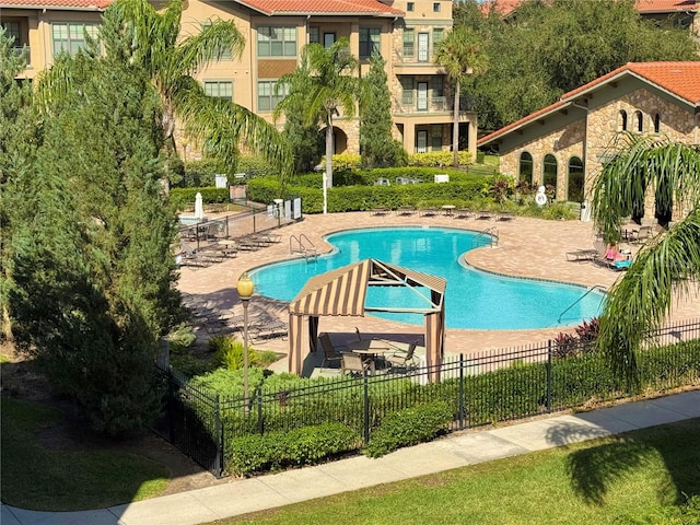 view of swimming pool featuring a patio area