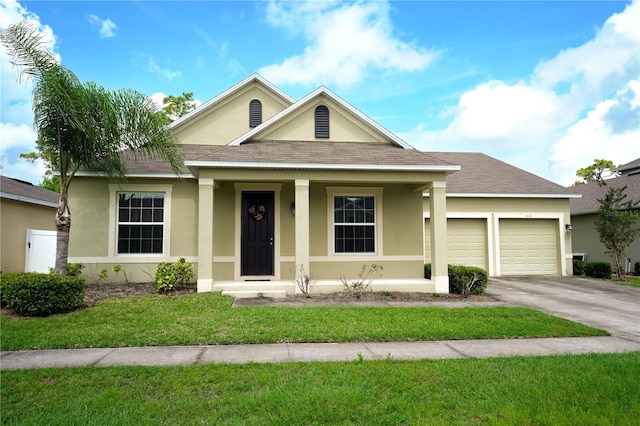 view of front of property with a front lawn, a garage, and a porch