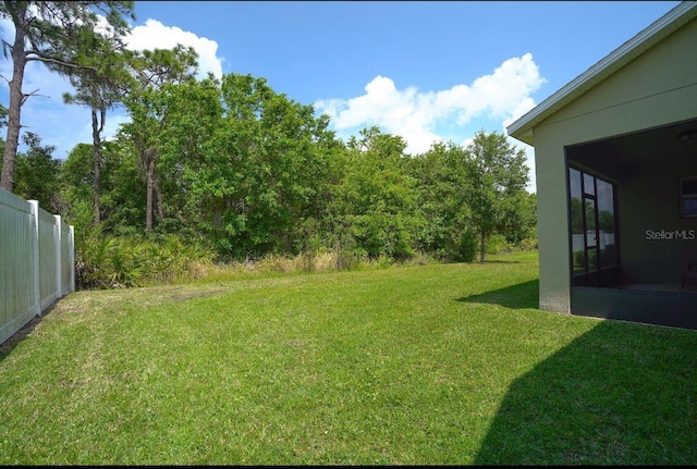 view of yard with a sunroom