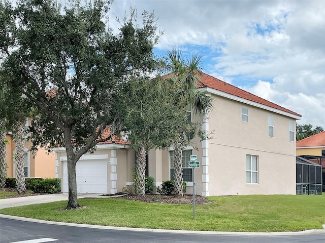 view of home's exterior with a garage and a lawn