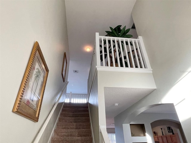 stairway with a high ceiling