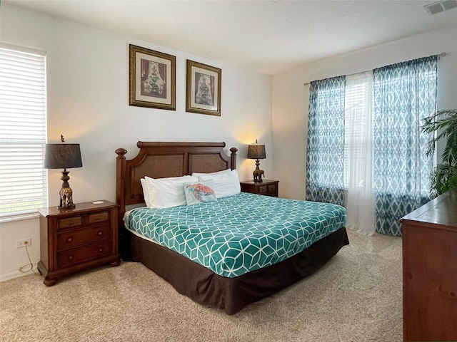 bedroom with light colored carpet