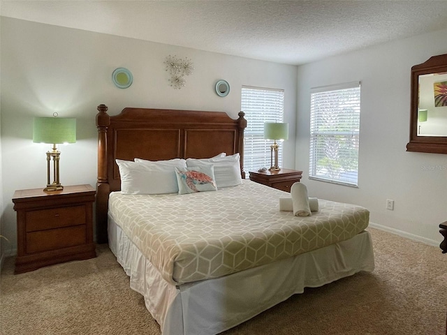 carpeted bedroom with a textured ceiling