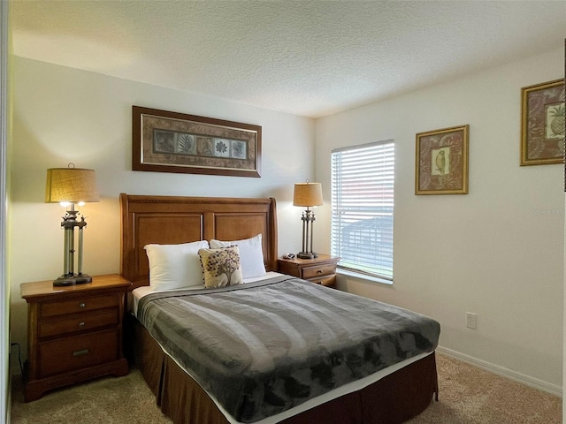 carpeted bedroom with a textured ceiling