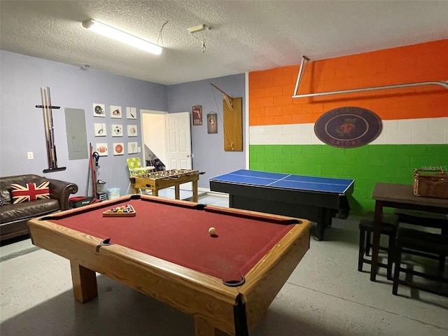 rec room with a textured ceiling, billiards, and electric panel