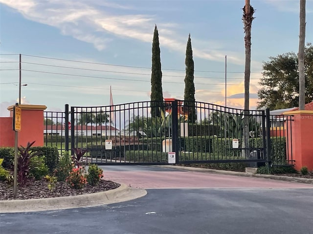 view of gate at dusk