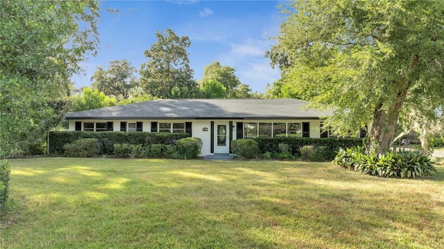 ranch-style house with a front yard