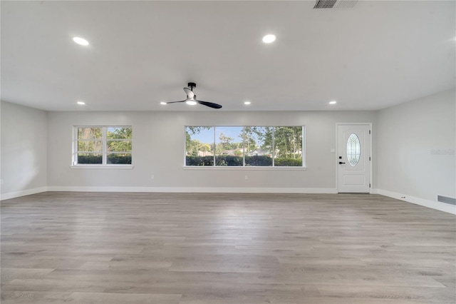 interior space featuring light wood-type flooring and ceiling fan