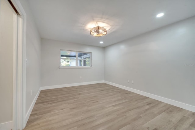 unfurnished room featuring light hardwood / wood-style floors