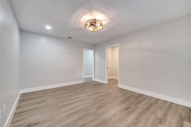 unfurnished room with light hardwood / wood-style flooring