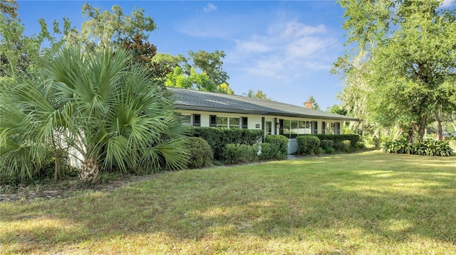 exterior space featuring a front lawn