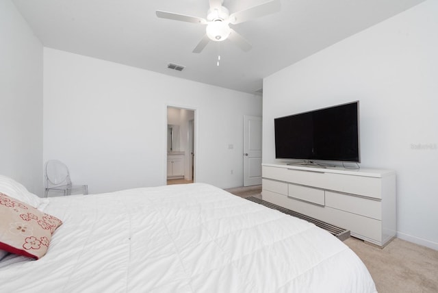 bedroom with ceiling fan and light carpet