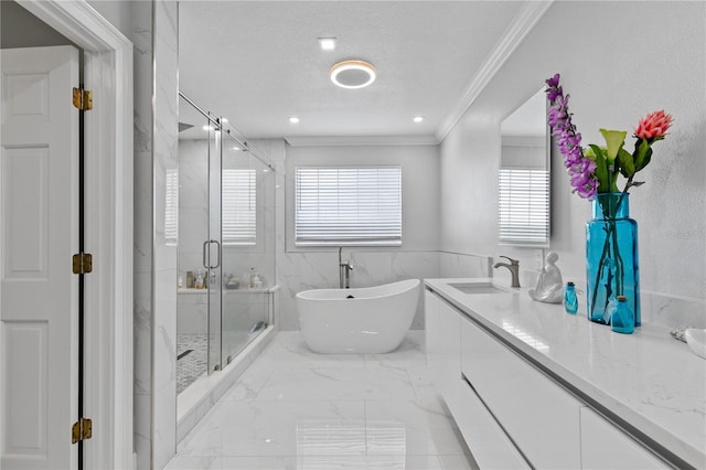 bathroom featuring separate shower and tub, vanity, ornamental molding, tile walls, and a textured ceiling