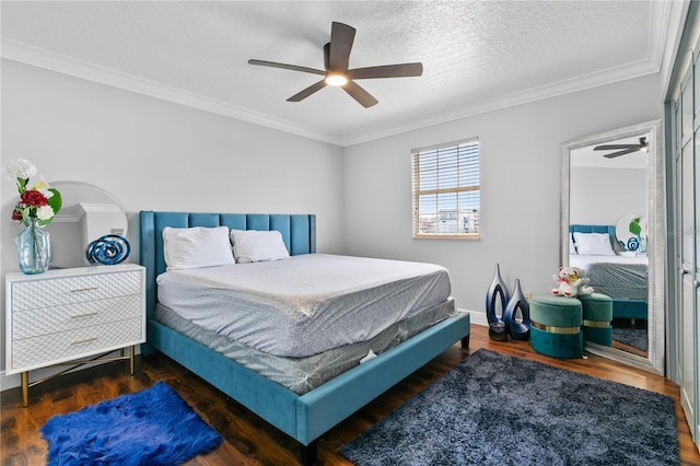 bedroom with ornamental molding, a textured ceiling, dark hardwood / wood-style floors, and ceiling fan