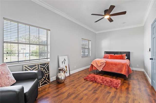 bedroom featuring ornamental molding, dark wood-type flooring, and ceiling fan