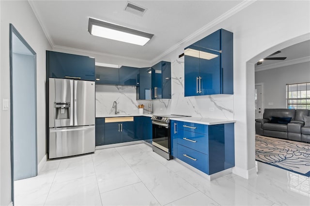 kitchen featuring blue cabinetry, crown molding, and appliances with stainless steel finishes