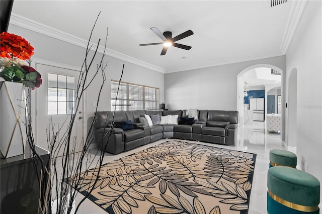 living room featuring crown molding and ceiling fan