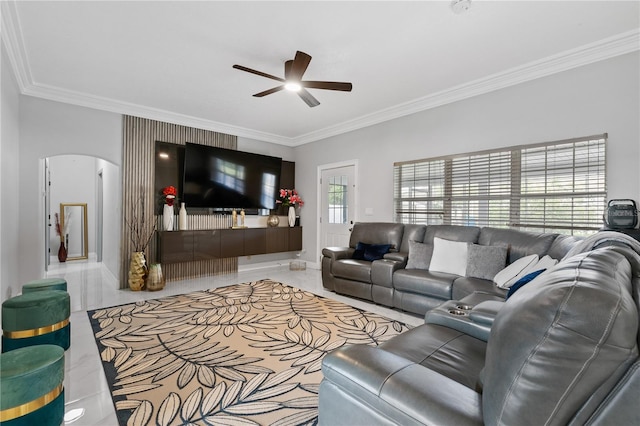 living room with ornamental molding and ceiling fan