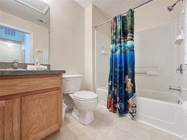 full bathroom with shower / tub combo with curtain, vanity, a textured ceiling, and toilet