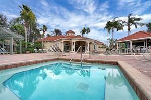 view of swimming pool with a gazebo and a patio