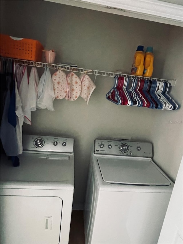 clothes washing area featuring independent washer and dryer