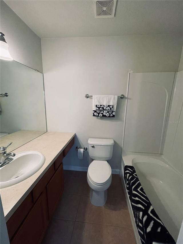 full bathroom with shower / tub combo, tile patterned floors, vanity, and toilet