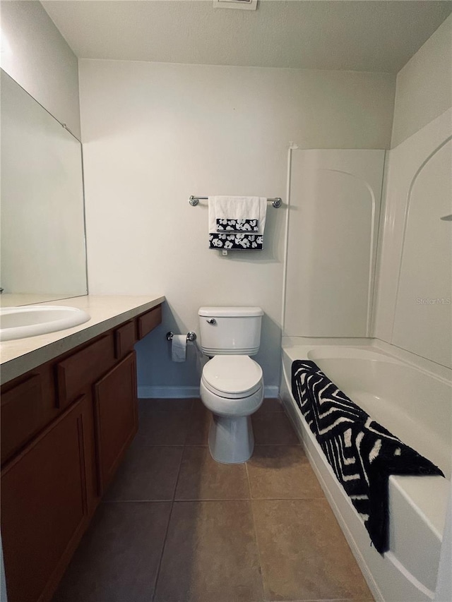 full bathroom featuring shower / tub combination, tile patterned floors, toilet, and vanity