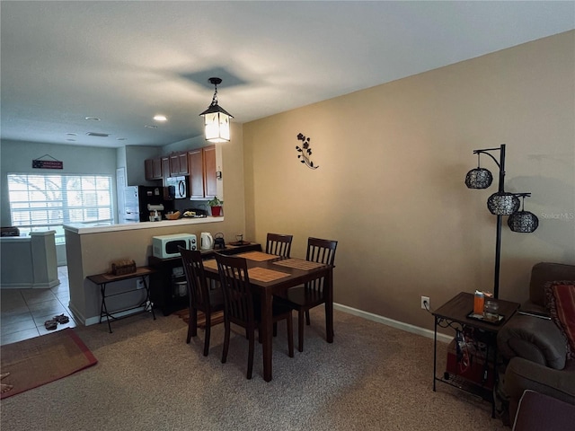 view of carpeted dining space