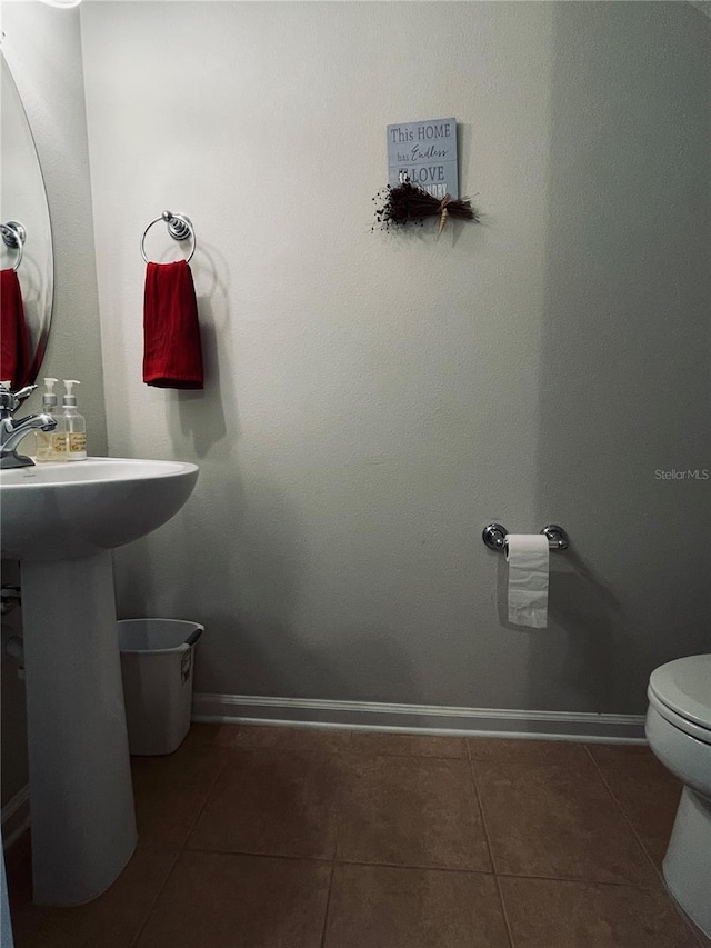 10453 Westpark Preserve Blvd, Tampa, FL 33625 - bathroom featuring tile patterned flooring, toilet, and baseboards