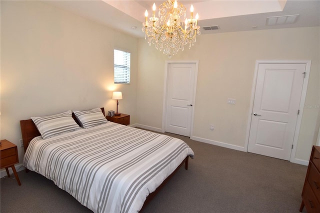 carpeted bedroom with a notable chandelier