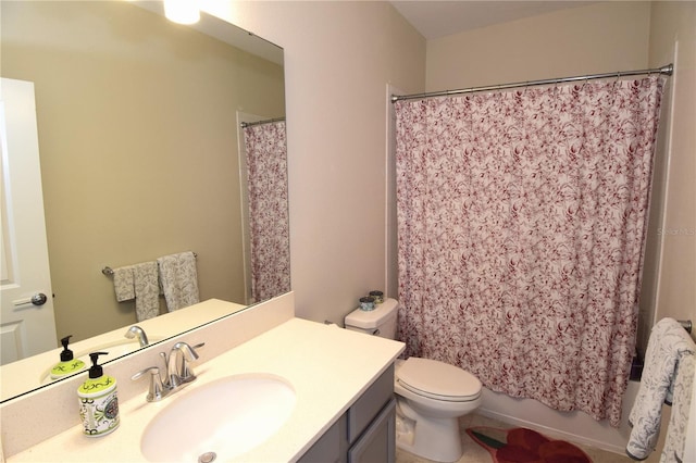 full bathroom with vanity, shower / bath combo with shower curtain, and toilet