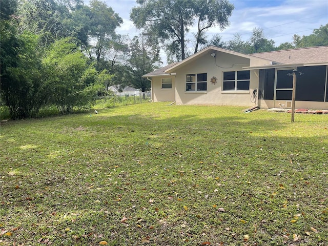 view of yard with a sunroom