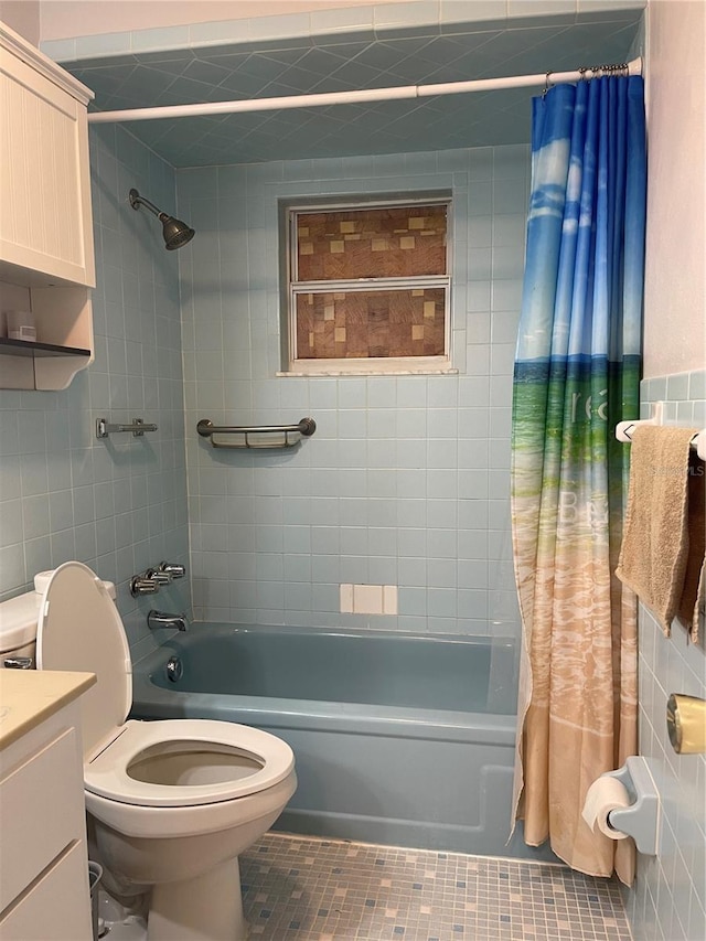 full bathroom with shower / bath combo, vanity, tile patterned flooring, and toilet