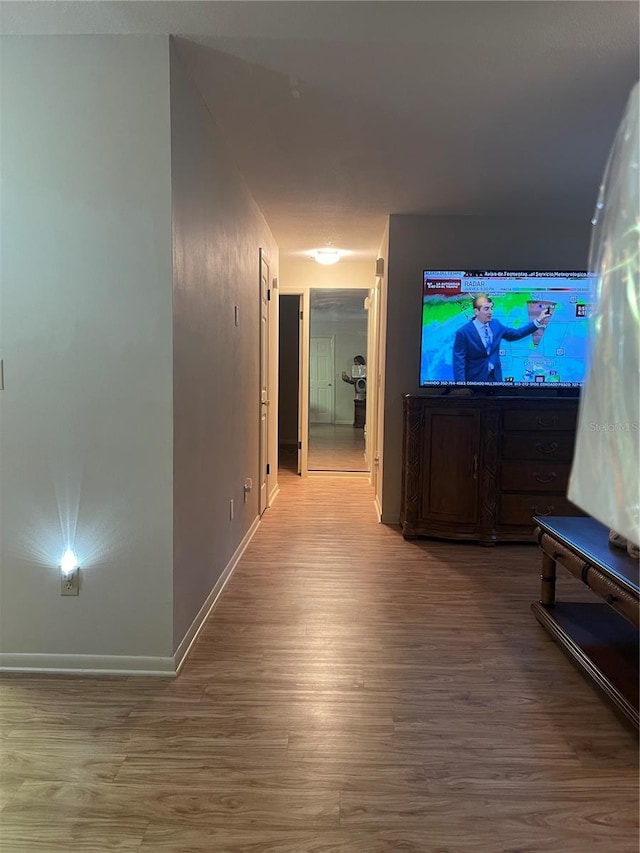 corridor featuring hardwood / wood-style flooring