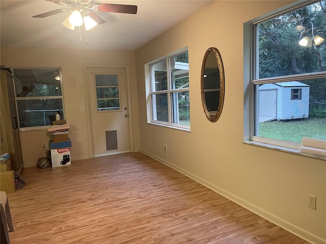 interior space featuring light hardwood / wood-style flooring, a wealth of natural light, and ceiling fan