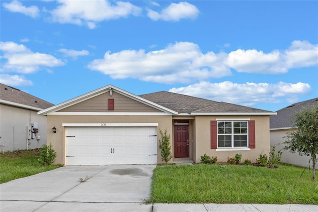 ranch-style house featuring a front yard and a garage