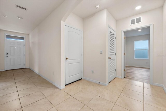 hallway with light tile patterned flooring