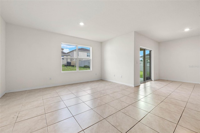 spare room with light tile patterned floors