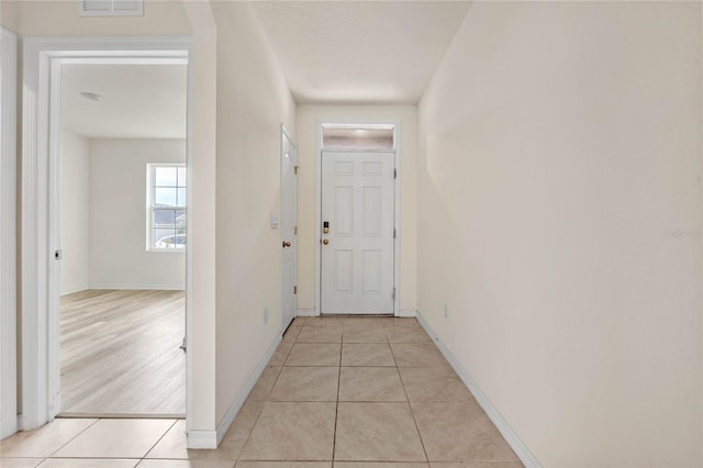 corridor featuring light hardwood / wood-style floors