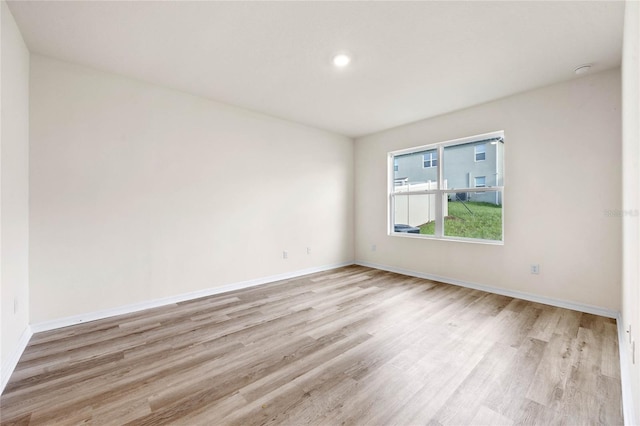 spare room featuring light hardwood / wood-style flooring