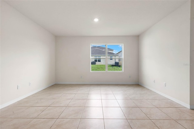 spare room featuring light tile patterned floors