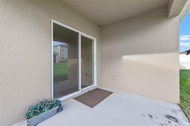 doorway to property featuring a patio area