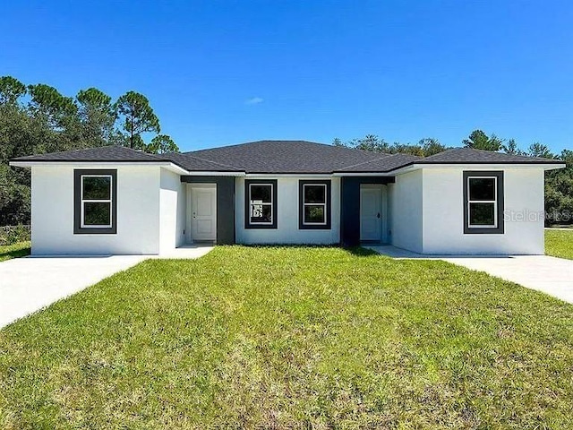 single story home with a front yard