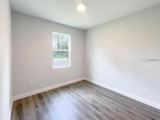 spare room featuring hardwood / wood-style flooring