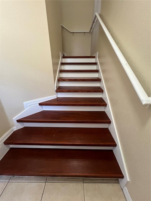 staircase with tile patterned flooring