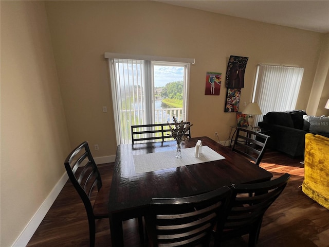 dining space with dark wood-type flooring